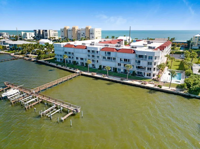 a view of a lake with a table and chairs
