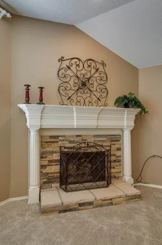 a fireplace with a wall