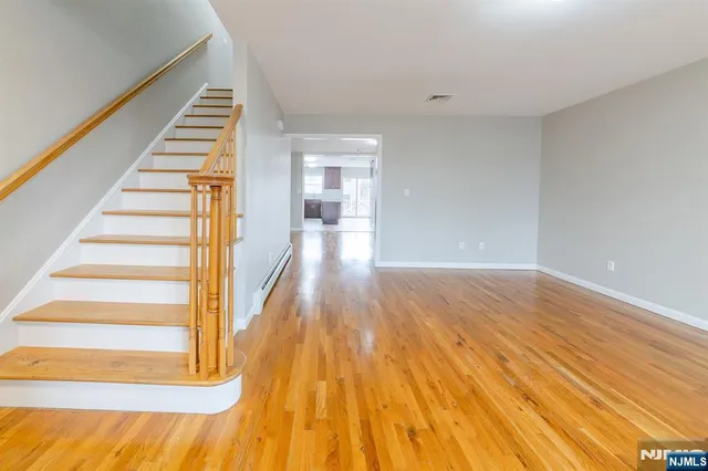 a view of an entryway with wooden floor