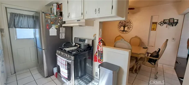 a utility room with multiple dryer and washer