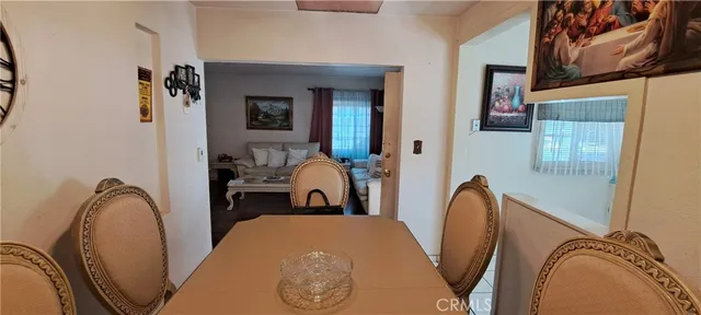 a view of a bedroom with bed and furniture