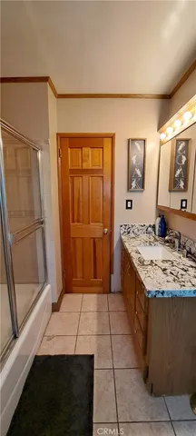 a kitchen with a sink stove and refrigerator