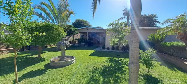 a swimming pool with lots of green space