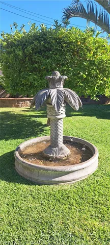 a view of a fountain in the garden