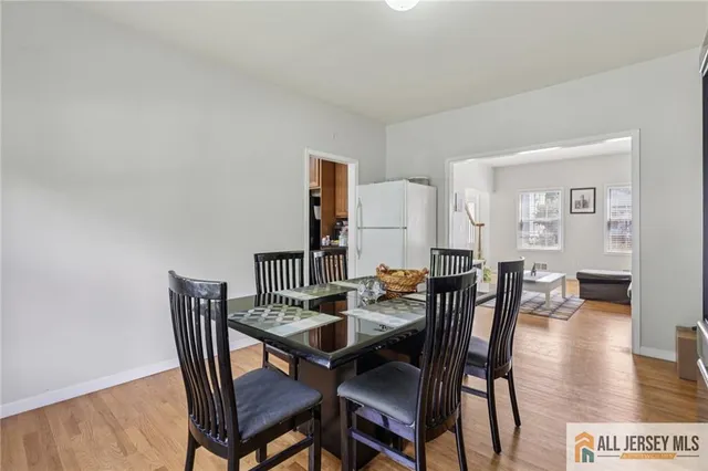 a kitchen with a refrigerator sink and cabinets
