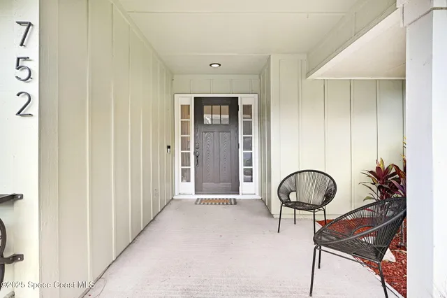 a view of a entryway with wooden floor