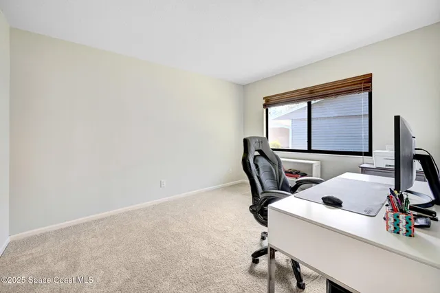 a workspace with furniture and bathroom