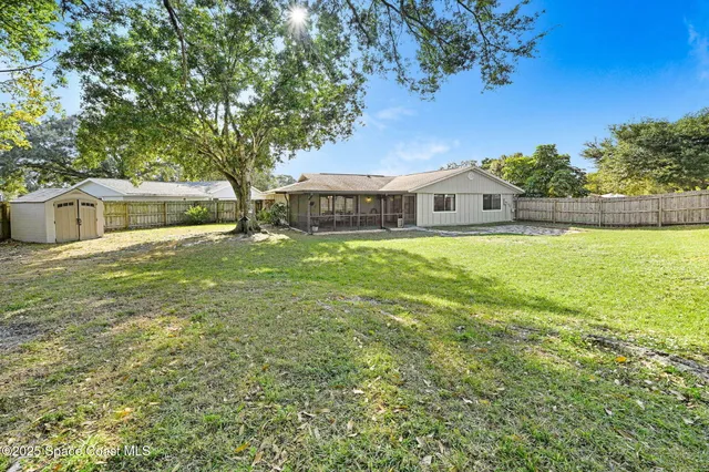 a view of a house with a big yard