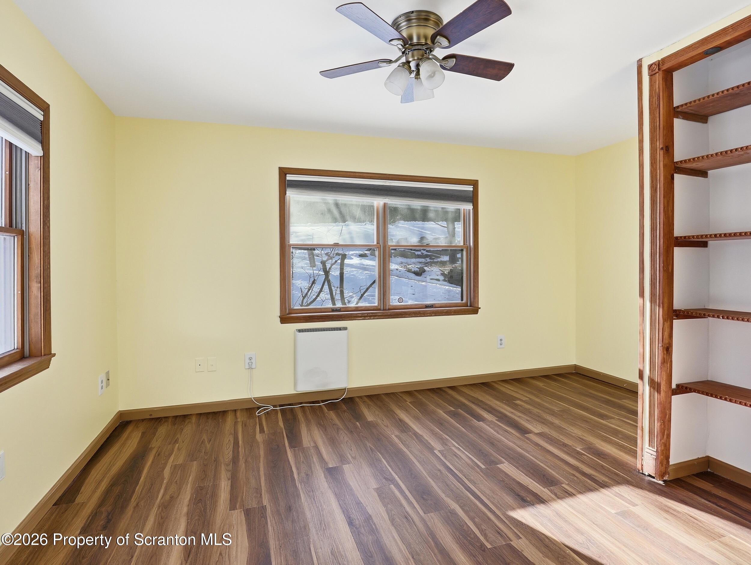 227 Image Drive Scotrun, PA 18355 - Photo 16 of 29 a view of an empty room with wooden floor and a window