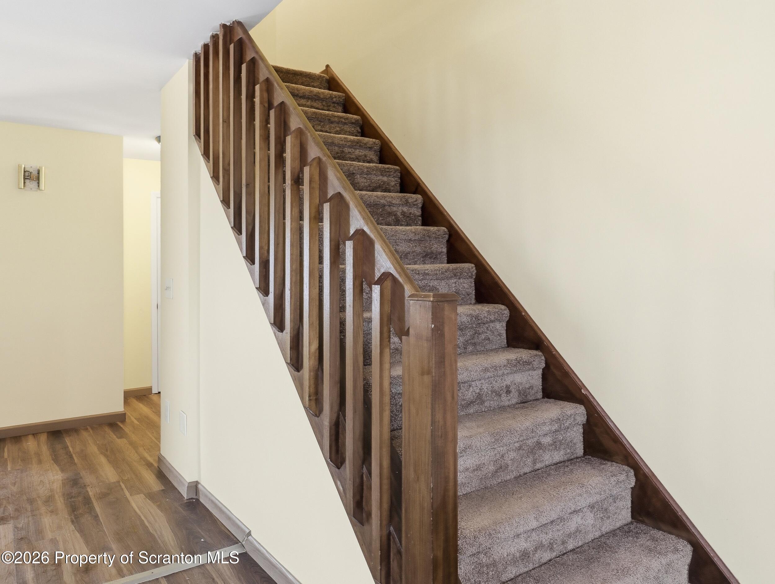 227 Image Drive Scotrun, PA 18355 - Photo 18 of 29 a view of staircase with wooden floor and white walls