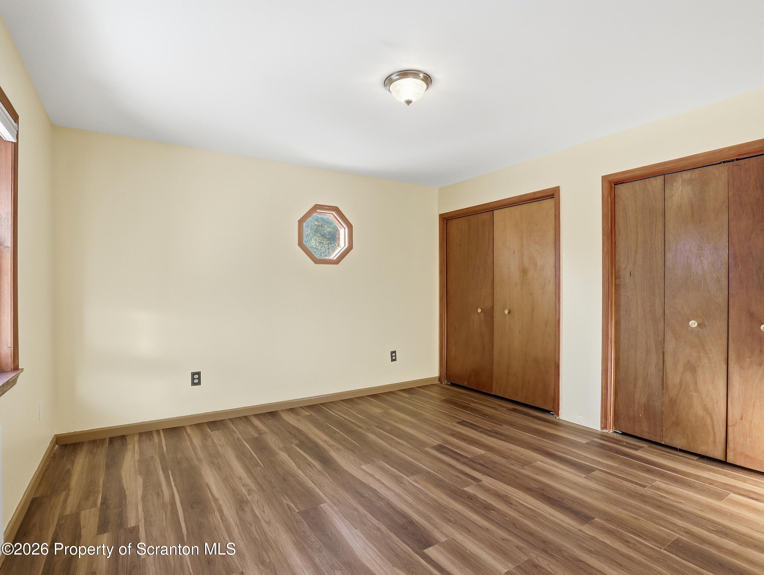 227 Image Drive Scotrun, PA 18355 - Photo 19 of 29 a view of an empty room with wooden floor