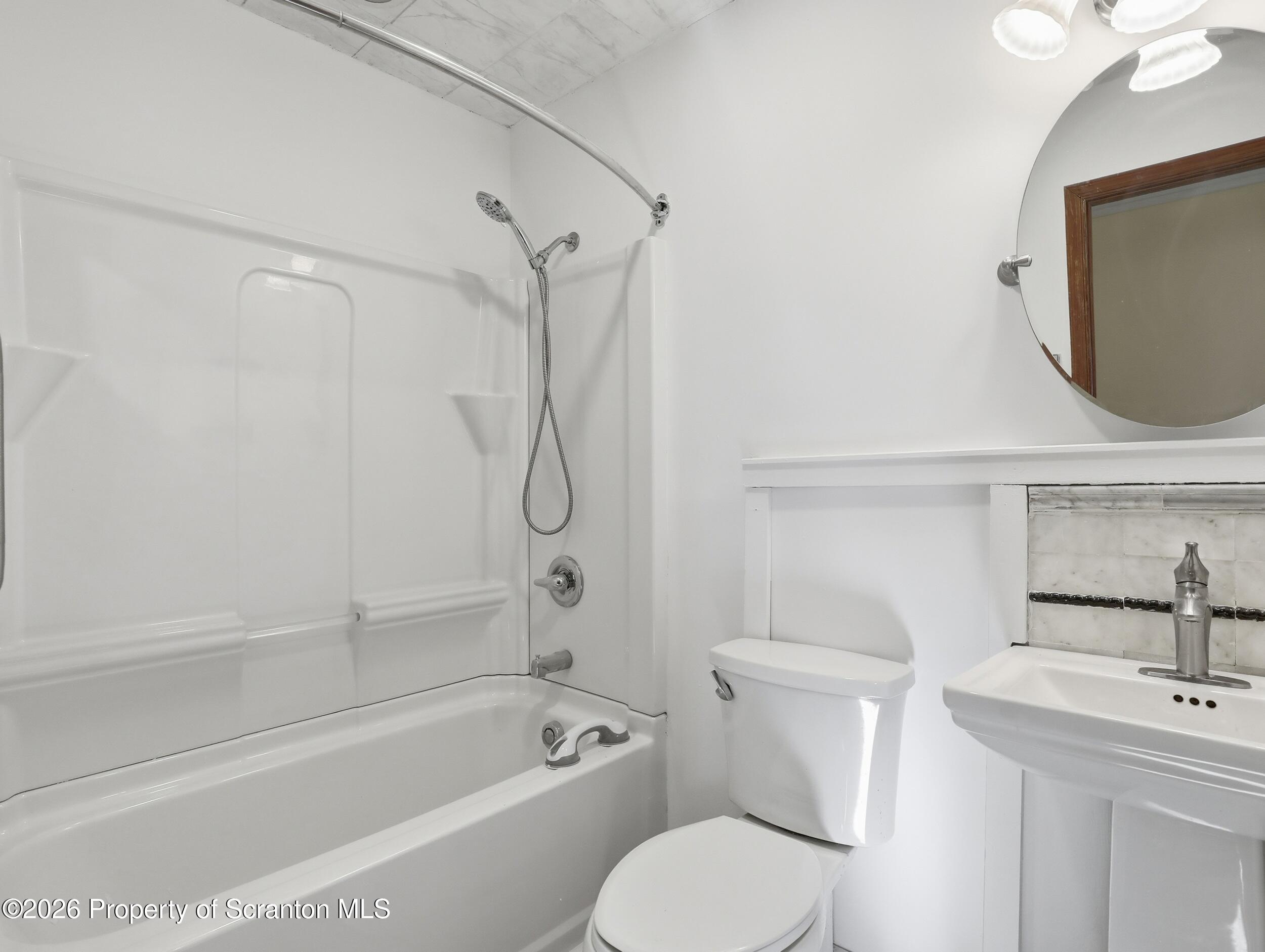 227 Image Drive Scotrun, PA 18355 - Photo 22 of 29 a bathroom with a toilet sink vanity tub and shower