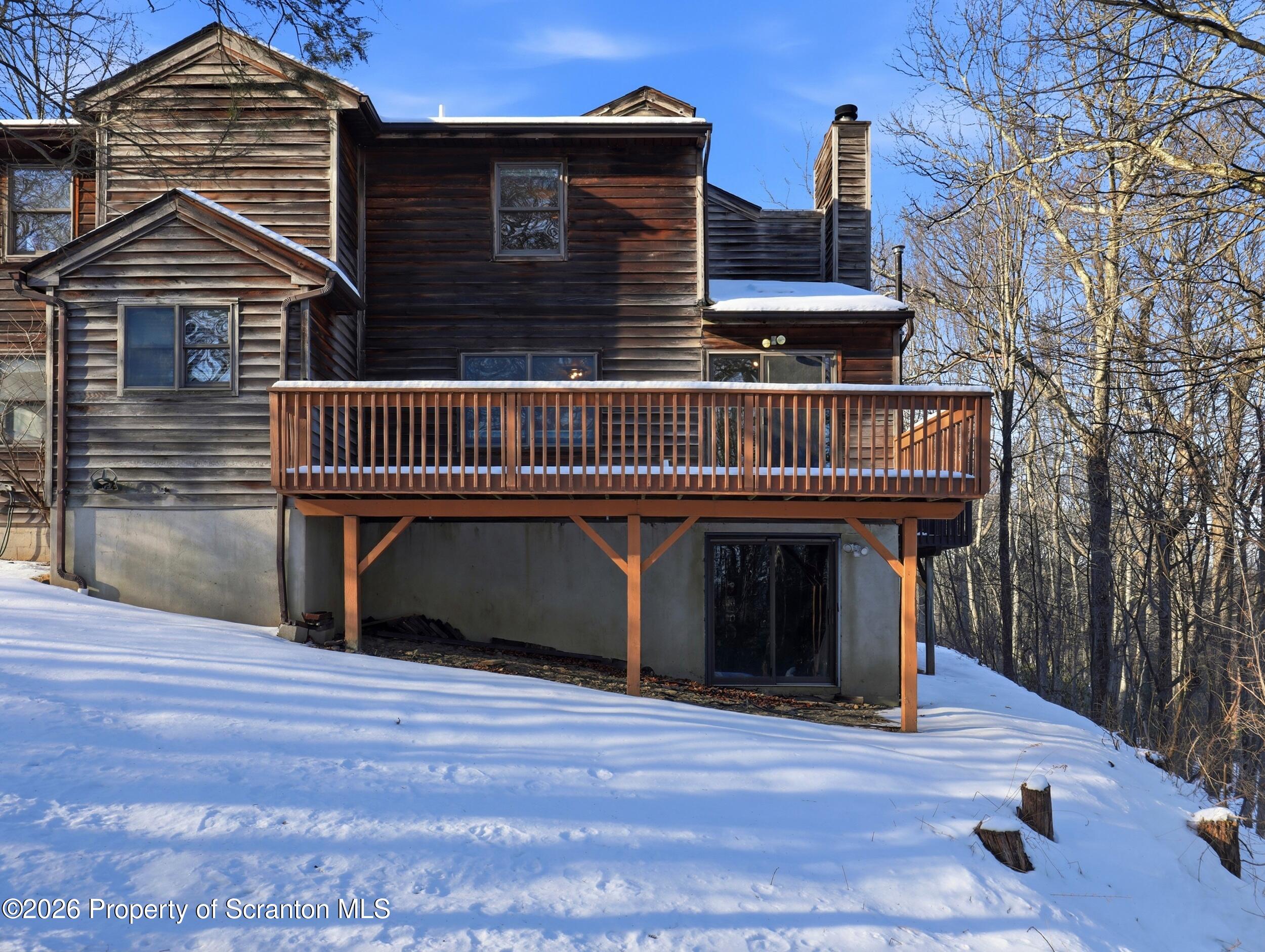 227 Image Drive Scotrun, PA 18355 - Photo 27 of 29 a view of a house with a deck