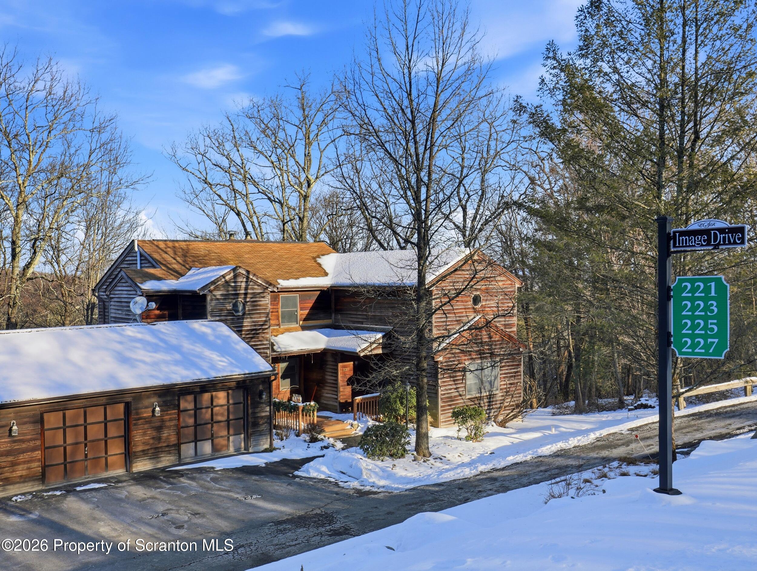 227 Image Drive Scotrun, PA 18355 - Photo 29 of 29 a front view of a house with a garden