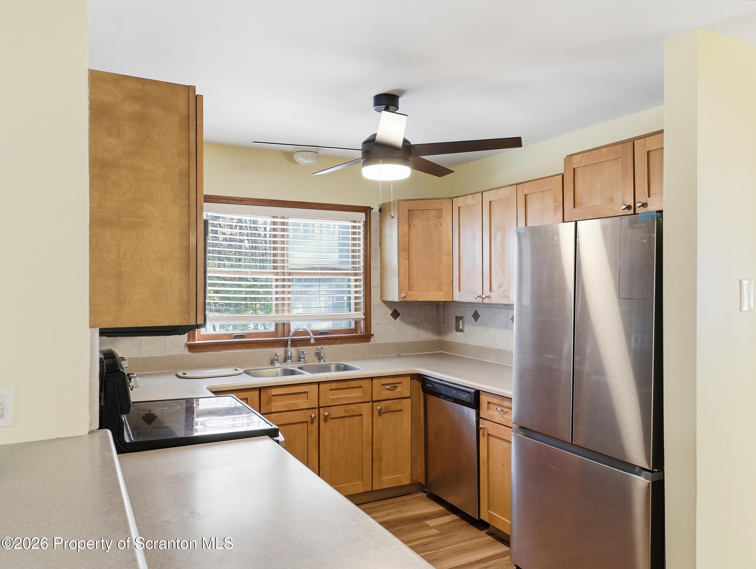 227 Image Drive Scotrun, PA 18355 - Photo 8 of 29 a kitchen with stainless steel appliances a refrigerator and a sink