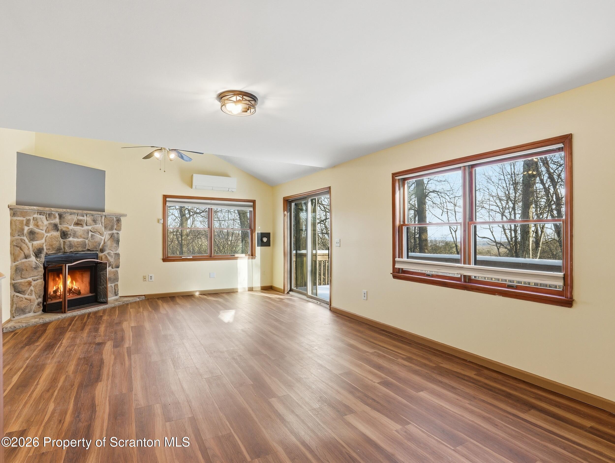 227 Image Drive Scotrun, PA 18355 - Photo 9 of 29 a view of an empty room with a window and fireplace