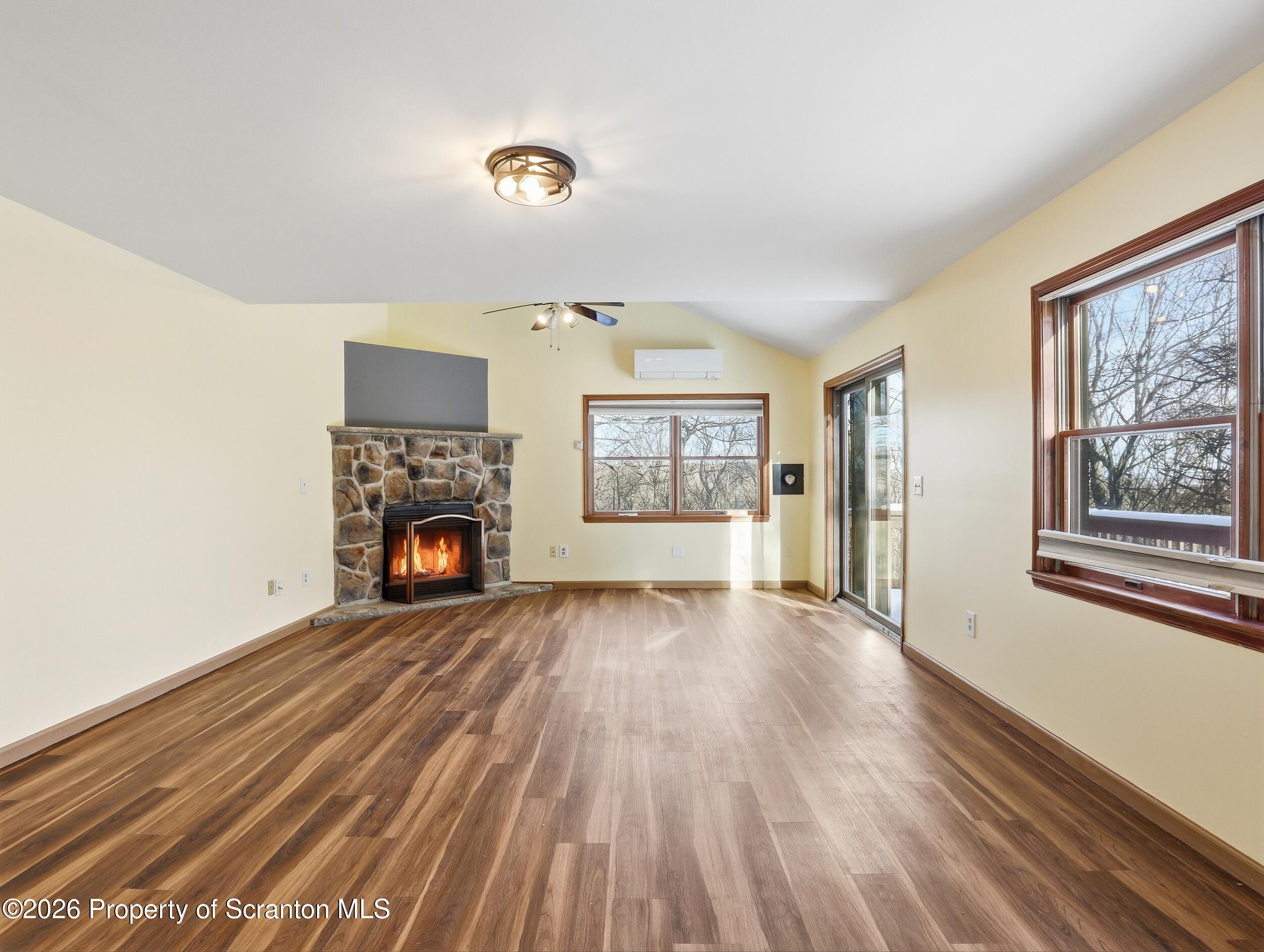 227 Image Drive Scotrun, PA 18355 - Photo 10 of 29 a view of an empty room with a window and fireplace