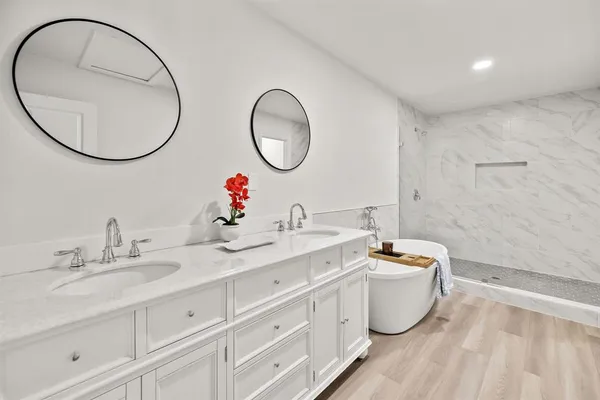 a bathroom with a toilet a sink and a mirror