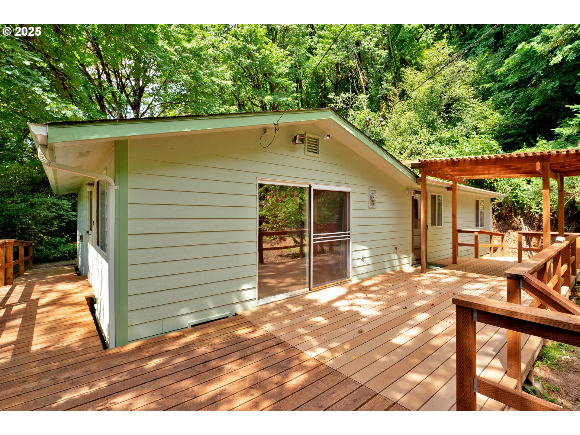 11406 East Mapleton Road Mapleton, OR 97453 - Photo 18 of 22 a front view of a house with a yard