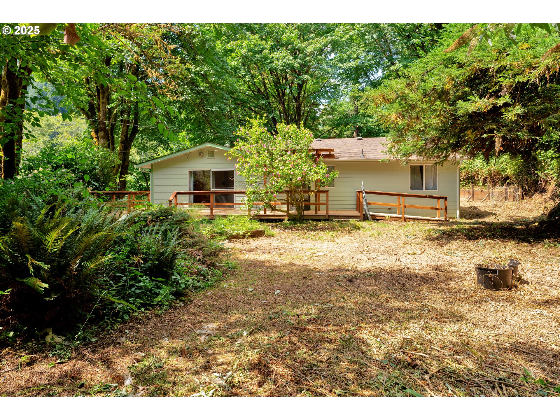 11406 East Mapleton Road Mapleton, OR 97453 - Photo 20 of 22 a front view of a house with a yard