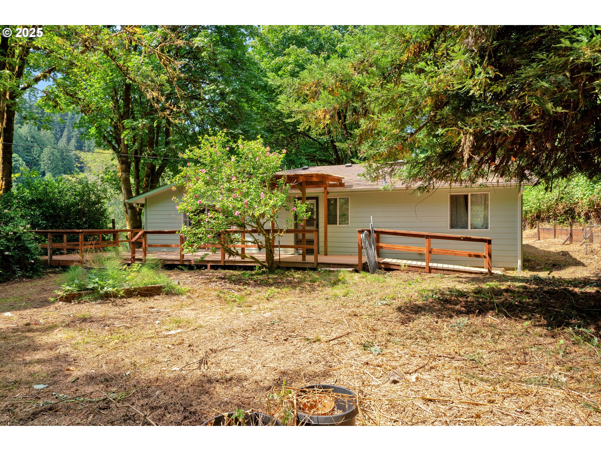 11406 East Mapleton Road Mapleton, OR 97453 - Photo 2 of 22 a backyard of a house with barbeque oven table and chairs