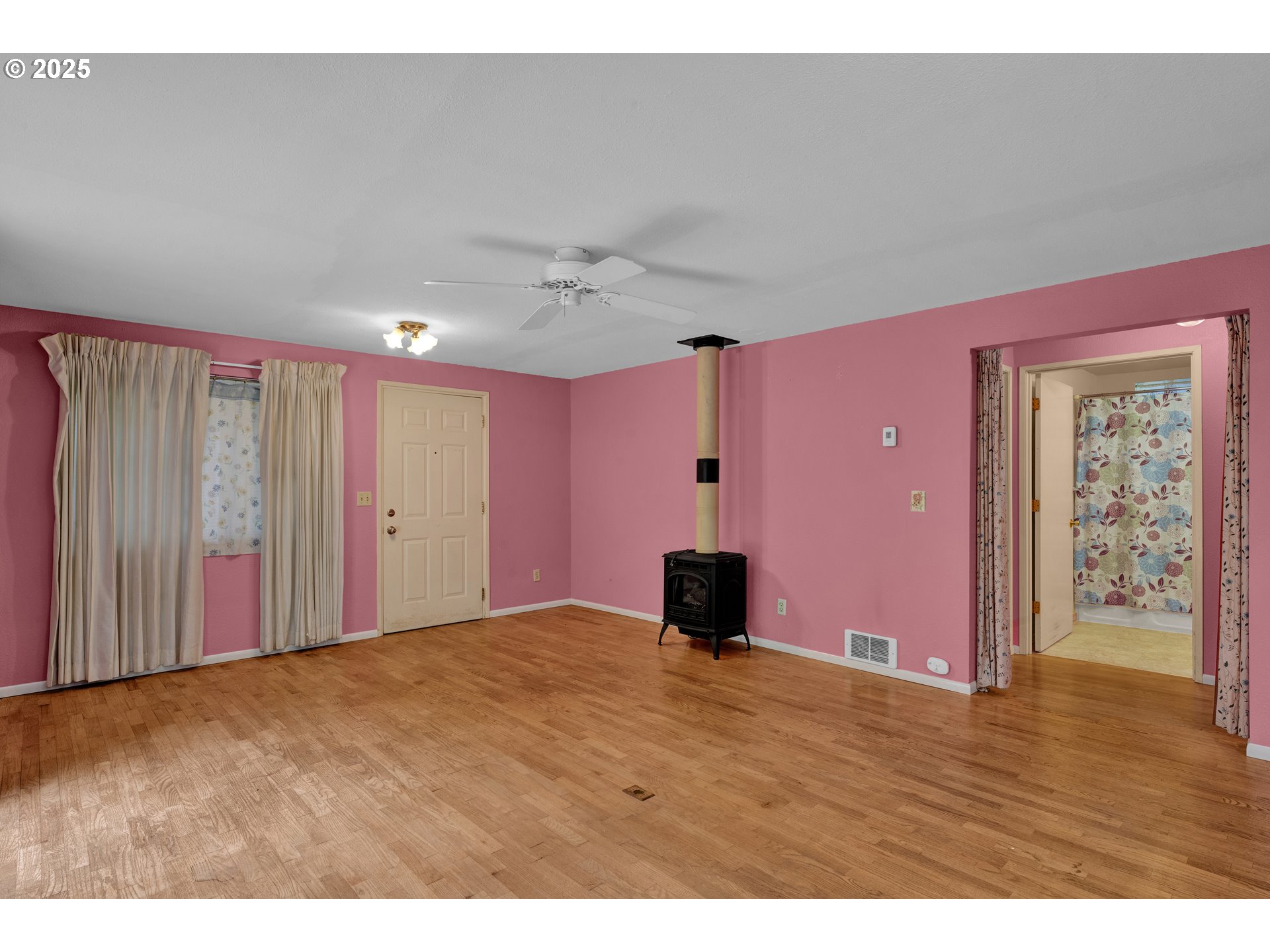 11406 East Mapleton Road Mapleton, OR 97453 - Photo 7 of 22 a view of an empty room with wooden floor