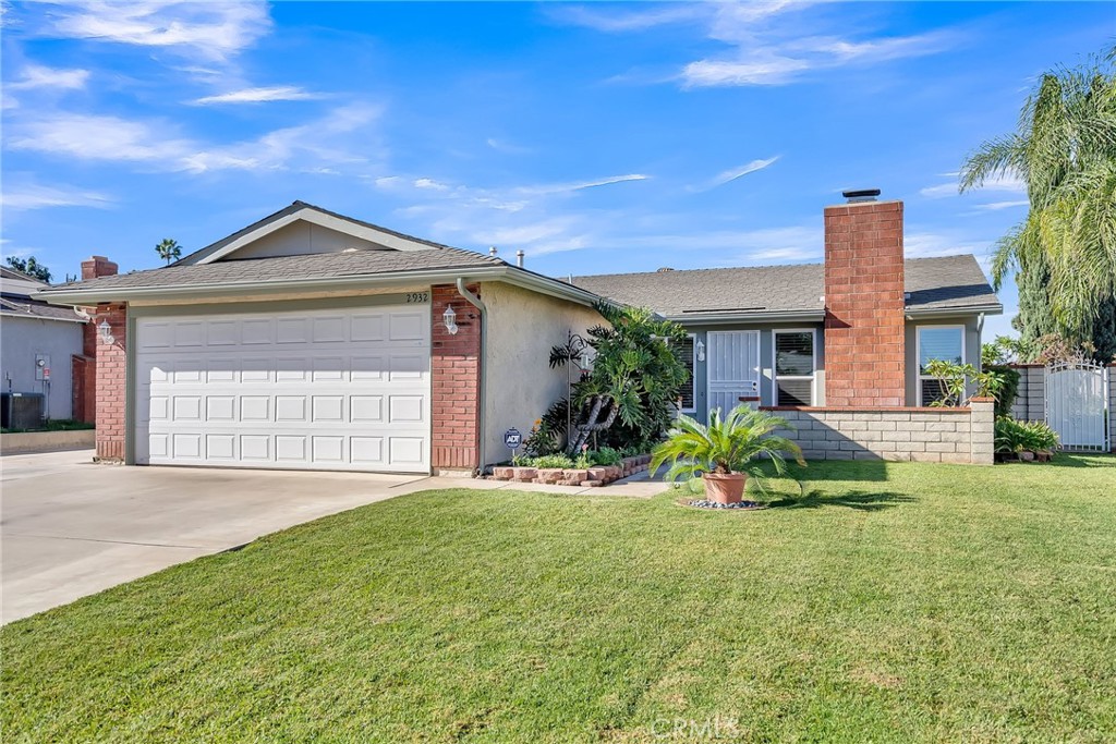 2932 Myers Street Riverside, CA 92503 - Photo 1 of 1 a front view of a house with a yard and potted plants