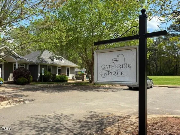 a sign on the side of a street