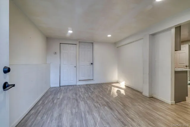 a kitchen with refrigerator and cabinets