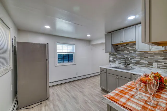 a bathroom with a shower a toilet and a sink