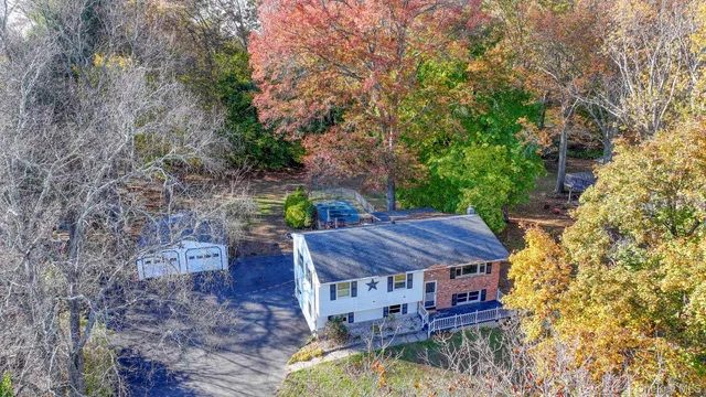 a view of a wooden house with a yard