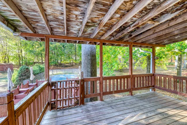 a view of a porch with wooden floor