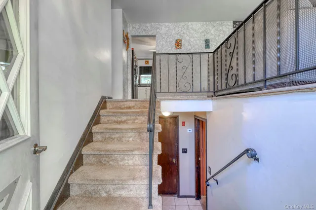 a view of staircase with railing and a stairs