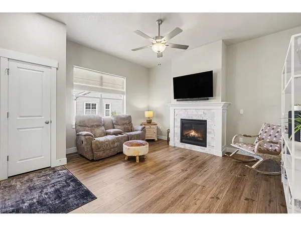 a living room with furniture fireplace and flat screen tv