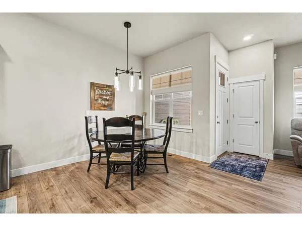 a kitchen with a table and chairs