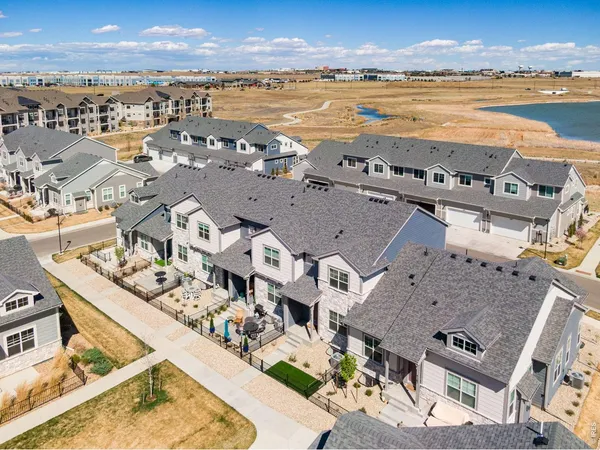 an aerial view of a house with a lake view