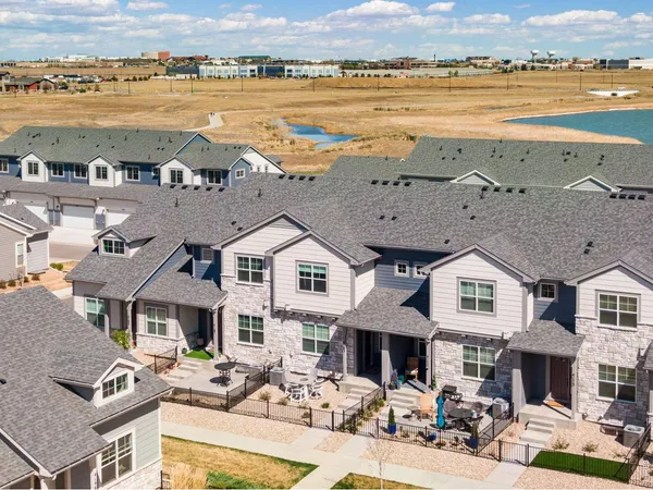 an aerial view of a building with outdoor space and ocean view