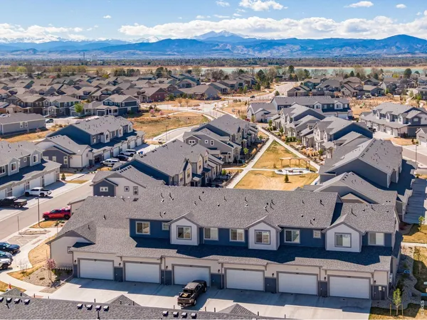 an aerial view of residential building with ocean view
