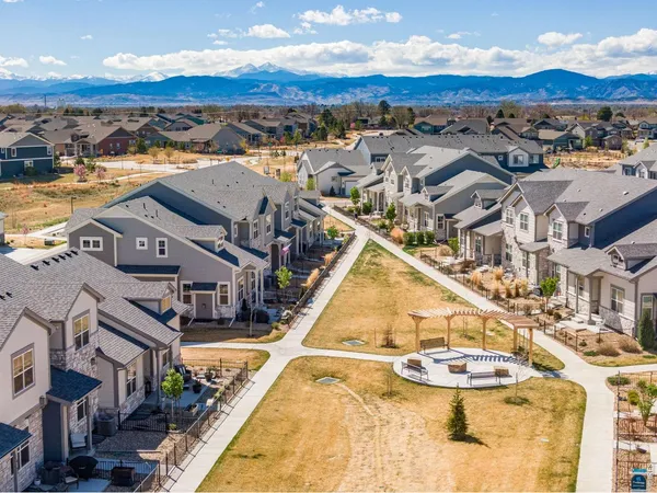 an aerial view of residential houses with outdoor space