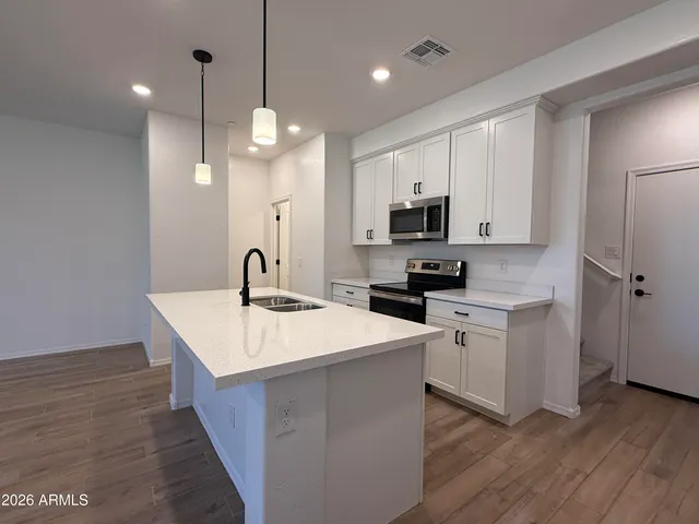 a bathroom with a toilet and a mirror