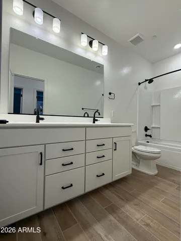 an empty room with a empty space and a ceiling fan