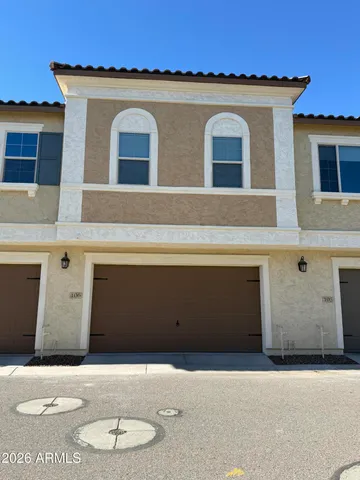 a front view of a house with a garage