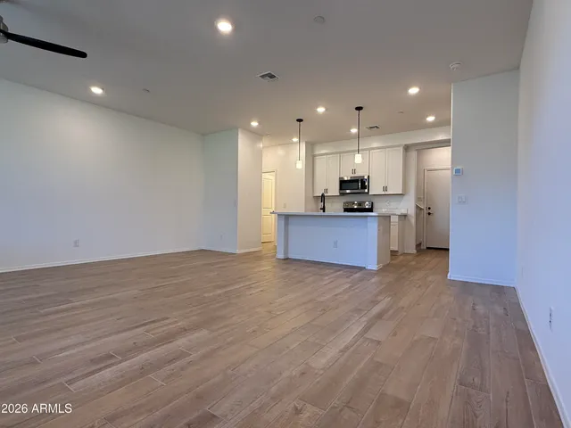 a view of a kitchen with a sink and a stove top oven