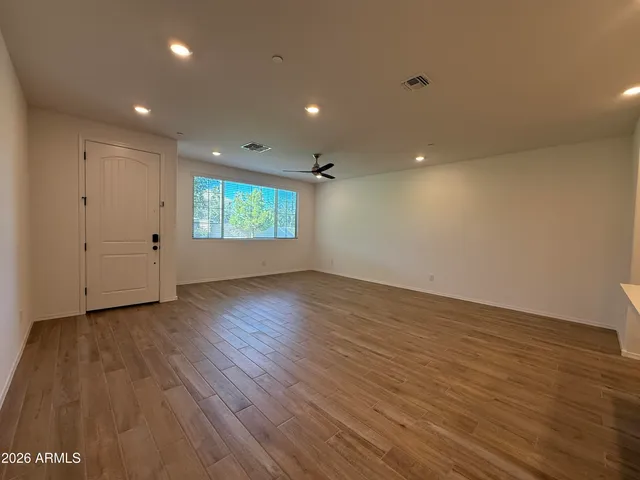 a kitchen with kitchen island a refrigerator a sink and chairs