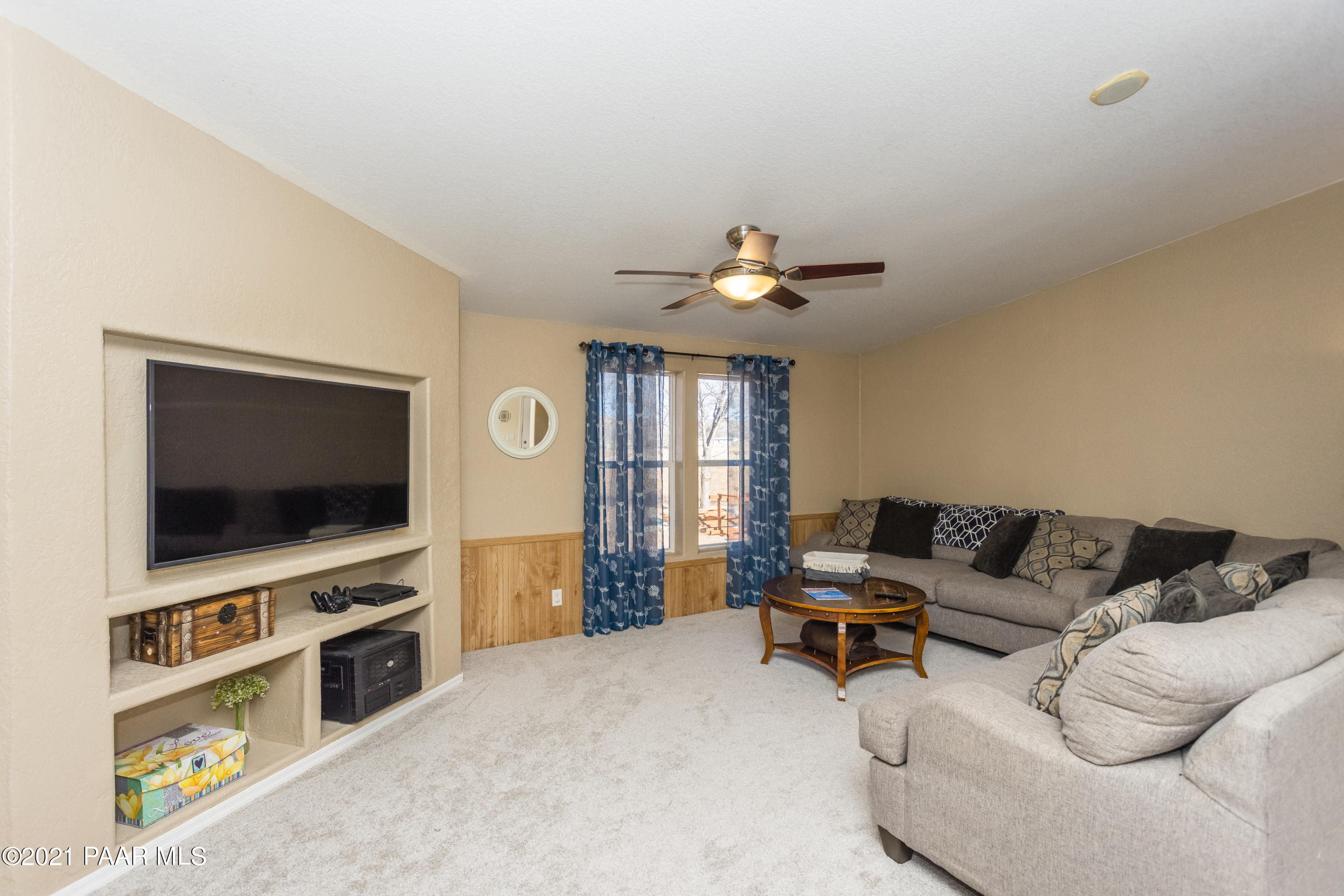25355 North Mitchell Road Paulden, AZ 86334 - Photo 12 of 37 a living room with furniture and a flat screen tv