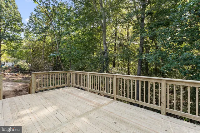 a view of balcony with wooden floor