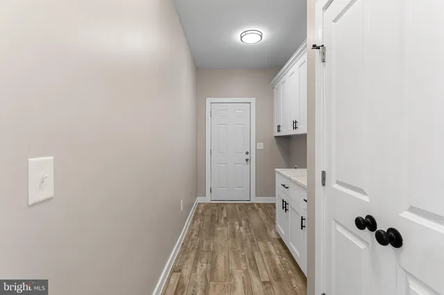 a view of entryway with wooden floor