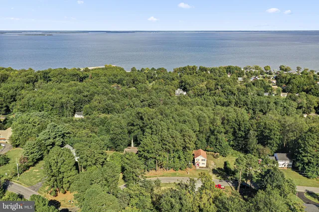 a aerial view of a house with a yard