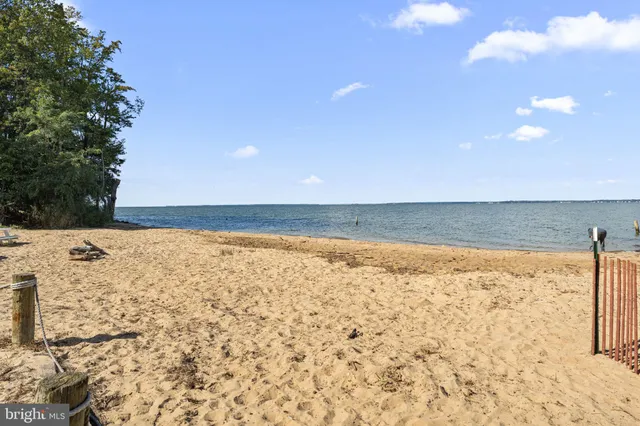 a view of a lake with houses in background