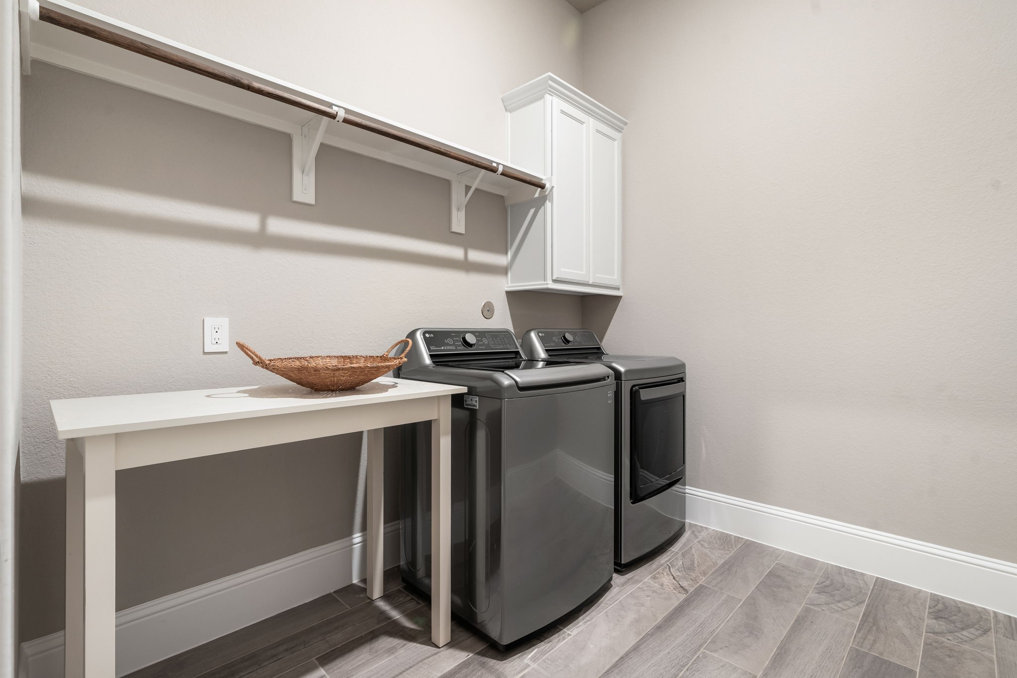 2206 Rope Maker Road Conroe, TX 77384 - Photo 13 of 42 A large and well-appointed laundry/utility room with extra storage and workspace.